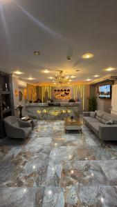 a large living room with couches and a fireplace at Viyana Suite Hotel in Istanbul
