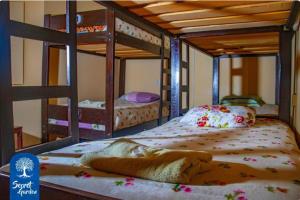 a bedroom with two bunk beds with at Secret Garden in Cusco