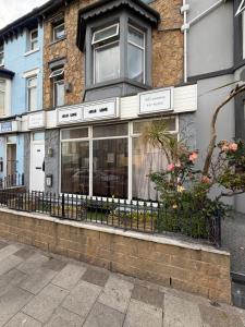 a store front of a building on a street at Suncrest Hotel # Self-check-in in Blackpool