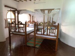 a bedroom with two bunk beds in a room at The Mousa House in Malindi