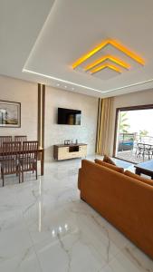 a living room with a couch and a table at zahara appartement in Tangier