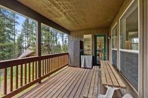 a porch of a house with a refrigerator on it at Stargazing Retreat in Tamarack in Big Creek +40 photos