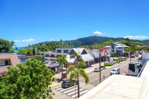 an aerial view of a street in a small town at The Balcony at Airlie in Airlie Beach
