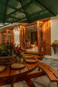 a wooden table with a potted plant on top of it at Casa Úrsula in Panama City +18 photos