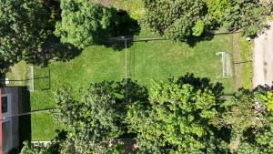 an overhead view of a lawn with trees and a field at Finca para estrenar in Anapoima