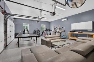 a living room with a couch and a table at Private Waterfront Villa 9 BR Peaceful in Laval