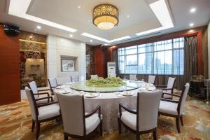 a meeting room with a large table and chairs at Empark Grand Hotel Fuzhou in Fuzhou +56 photos