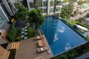 an overhead view of a swimming pool in a building at BTS Thong Lor Central High -rise Condo in Bangkok +9 photos