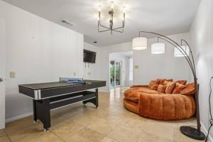 a living room with a couch and a piano at Mountain Trail Retreat in Austin