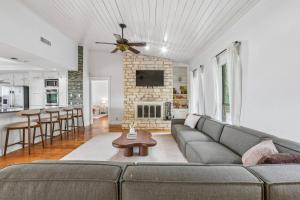 a living room with a couch and a table at Mountain Trail Retreat in Austin +42 photos