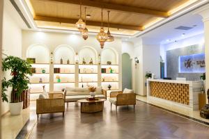 a lobby of a store with couches and chairs at Empark Grand Hotel Fuzhou in Fuzhou