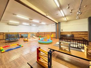 a play room with many different kinds of play equipment at Pension Kobekko in Otari