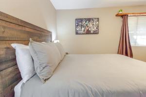 a bedroom with a large bed with white pillows at Mountain House in Mariposa