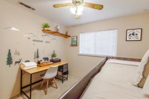 a bedroom with a desk and a bed and a table at Mountain House in Mariposa