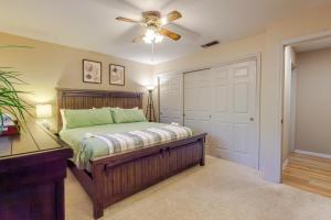 a bedroom with a bed and a ceiling fan at Mountain House in Mariposa