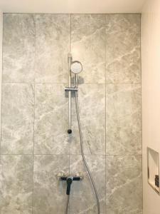 a shower with a shower head in a bathroom at Heaven View Krabi SHA in Ao Nam Mao +67 photos