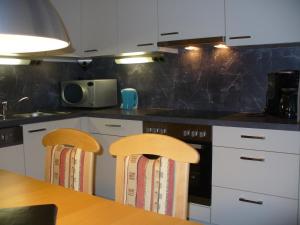 Кухня или мини-кухня в FerienFuchs
