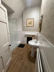 a bathroom with a sink and a fireplace at The Navigation Inn Hotel in Derby +41 photos