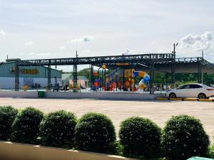 a playground in front of a building with a play equipment at Minh Hai Hotel Lao Bao in Lao Bao
