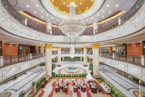 a large building with a chandelier in the middle at Empark Grand Hotel Fuzhou in Fuzhou