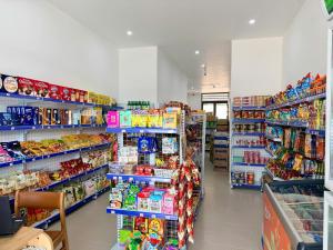 a store aisle of a grocery store filled with food at Minh Hai Hotel Lao Bao in Lao Bao