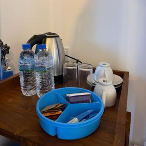a table with bottles of water and glasses on it at Forest River Escape Ella in Ella