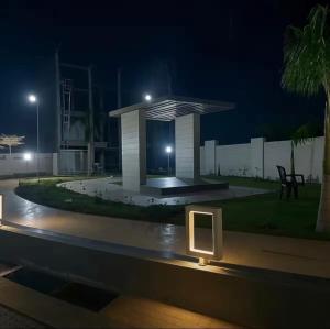 a building with a sign in front of it at night at cloud nine in Boria Kalān