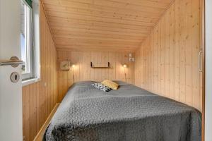 a bedroom with a bed in a small room at C11326-Tarm-Sortbaervej-20 in Tarm