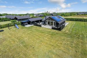 an overhead view of a house with a large yard at C11326-Tarm-Sortbaervej-20 in Tarm