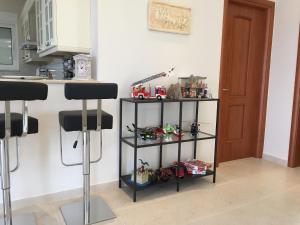 a kitchen with a shelf with toys on it at Villa Paradeisi in Paradeísion