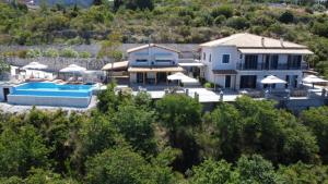 an aerial view of a house with a swimming pool at Lefkada Sunset Villa in Kalamitsi