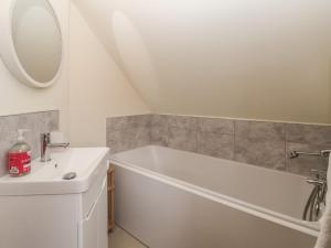 a bathroom with a white tub and a sink at Redwoods in Beverley +22 photos