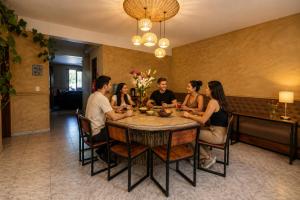 a group of people sitting around a table at Hostal Central Oaxaca in Oaxaca City +19 photos