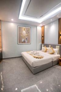 a bedroom with a large bed in a room at Khemra Kampot Hotel in Kampot in Kampot