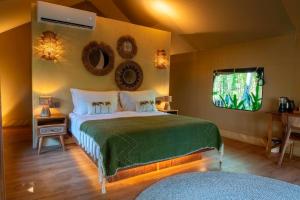 a bedroom with a large bed in a room at Vela Tianyar Boutique Resort - Oceanfront in Tianyar