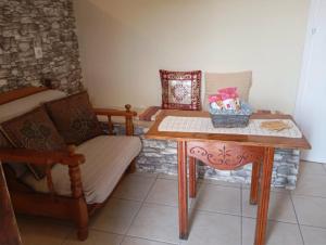 a room with a table and a chair and a table at Villa Vitta picola casa in Nafpaktos +57 photos