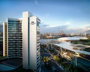 a view of a city skyline with a tall building at Thompson Shanghai Expo, by Hyatt in Shanghai