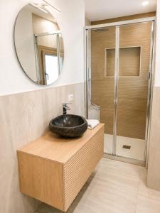a bathroom with a sink and a mirror at Marconi 306 in Quartu Sant'Elena +17 photos