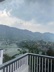 a view of a river from a balcony at Ramasa Lake House in Bhīm Tāl