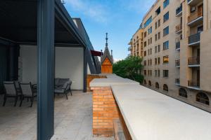 a view from the courtyard of a building with a church at Hayasa Hotel Old Yerevan in Yerevan