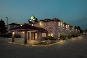 a hotel building with a sign on top of it at Days Inn by Wyndham Columbia Mall in Grand Forks