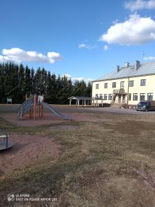 a playground in front of a building at Tattara School Room 2 in Nakkila