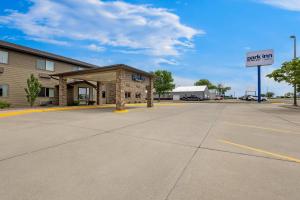 a empty parking lot in front of a hotel at Park Inn by Radisson Ortonville in Ortonville