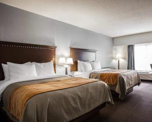 a hotel room with two beds and a window at Comfort Inn & Suites Lumberton Central I-95 in Lumberton +18 photos