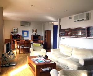 a living room with a couch and a table at La Casa del Limonero in El Puerto de Santa María