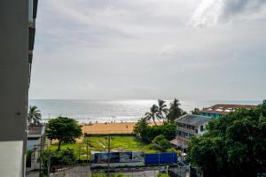 a view of a beach and the ocean at Ceylon Vacation - Negombo in Negombo