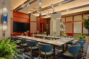 a conference room with a long table and chairs at Canopy By Hilton Bangkok Sukhumvit in Bangkok +67 photos