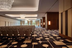 a conference room with a rows of chairs in a building at Conrad Athens The Ilisian in Athens +182 photos