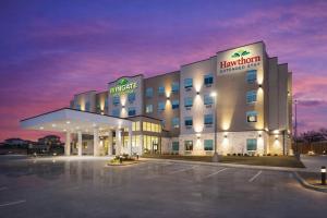 a hotel building with a parking lot at night at Wingate by Wyndham Austin North - Round Rock in Austin
