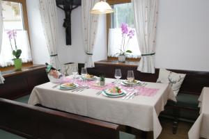a table in a restaurant with a white table cloth at Gasthaus Zum Stampf in Strass im Attergau